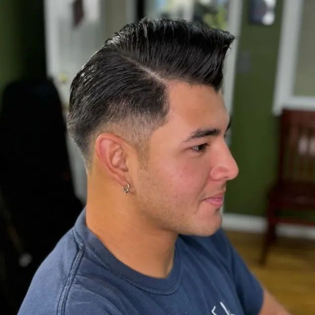Slick side part with a low fade.